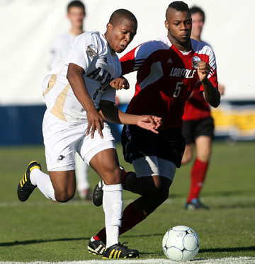 Darlington Naqbe of the University of Akron goes for the ball with Andrew Farrell of the University of Louisville during the 2010 College Cup final. TONY QUINN PHOTO