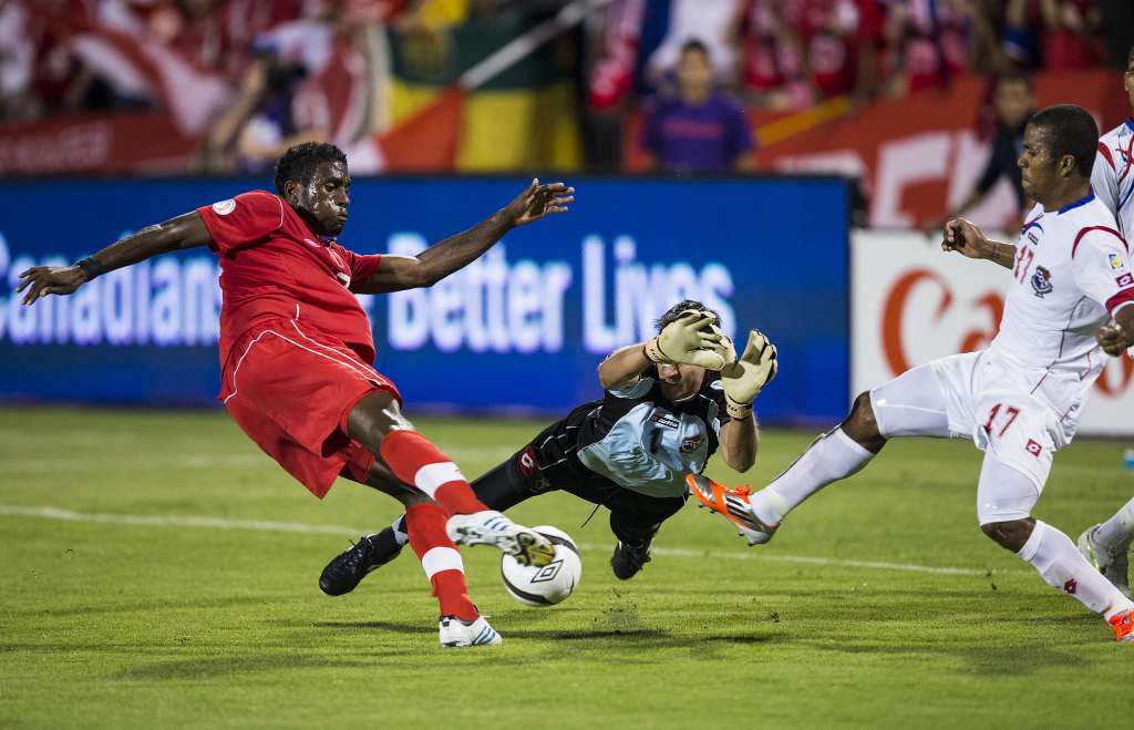 Panama's Jaime Penedo dives to try and stop Olivier Occean's effort. PHOTO: CANADA SOCCER/PAUL GIAMOU