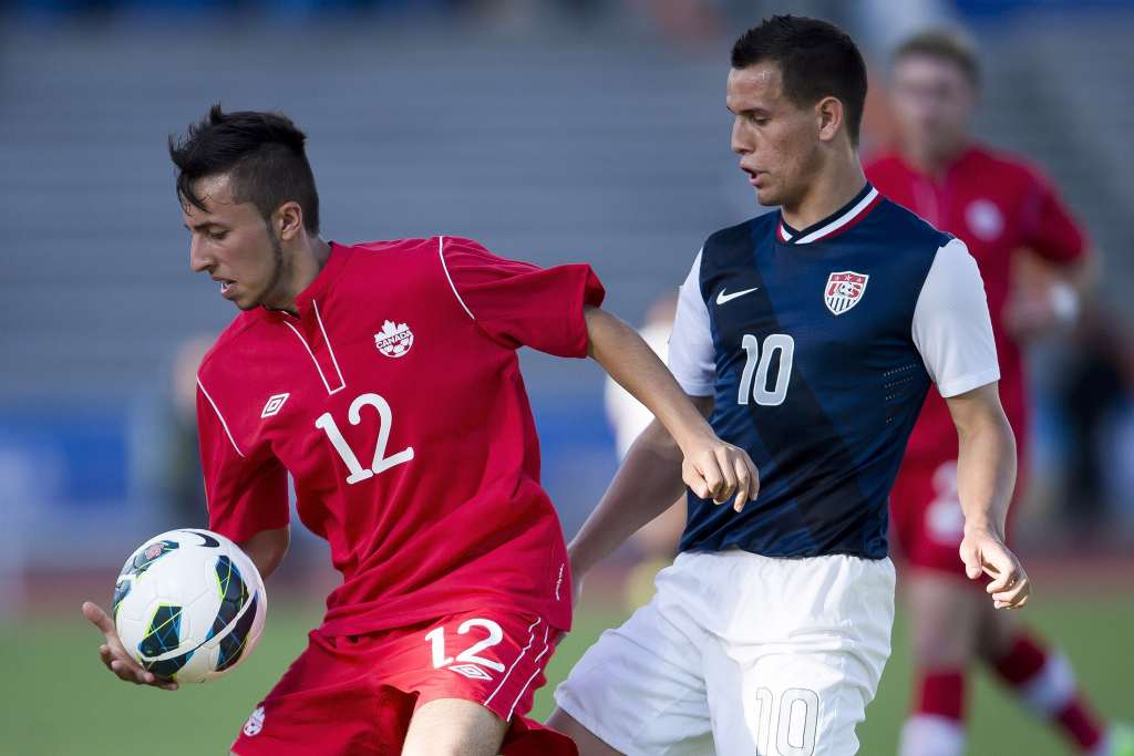 Canada's Dylan Carreiro keeps the ball away from the United States' Luis Gil. PHOTO: CANADA SOCCER/MEXSPORT