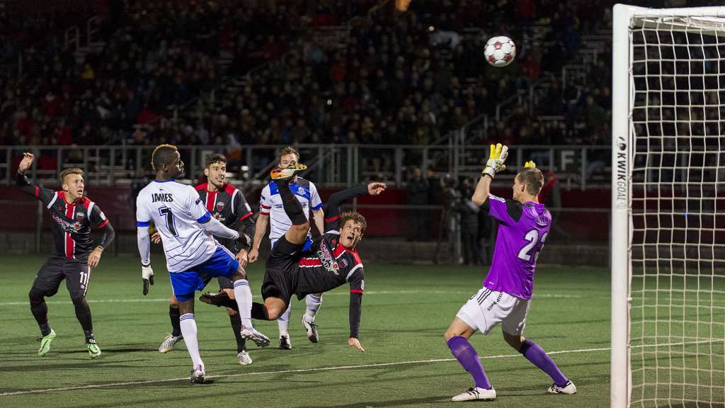 Ottawa's Mason Trafford has an effort on FCE keeper John Smits's goal. PHOTO: STEVE KINGSMAN/CANADA SOCCER