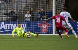Marcel de Jong is stopped by Whitecaps keeper Paolo Tornaghi. PHOTO: CANADA SOCCER/BOB FRID